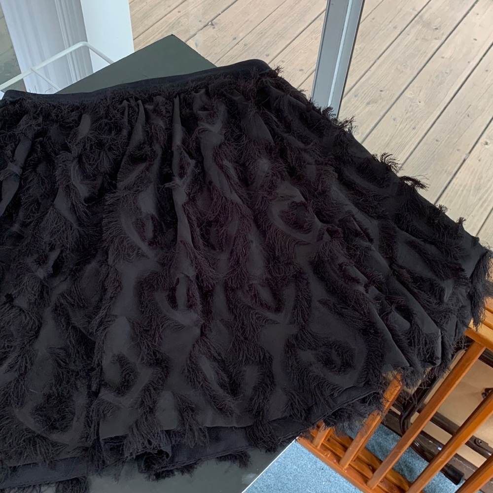 H&M black circle skirt with fun thread fringy detail. Lined. Sz 10